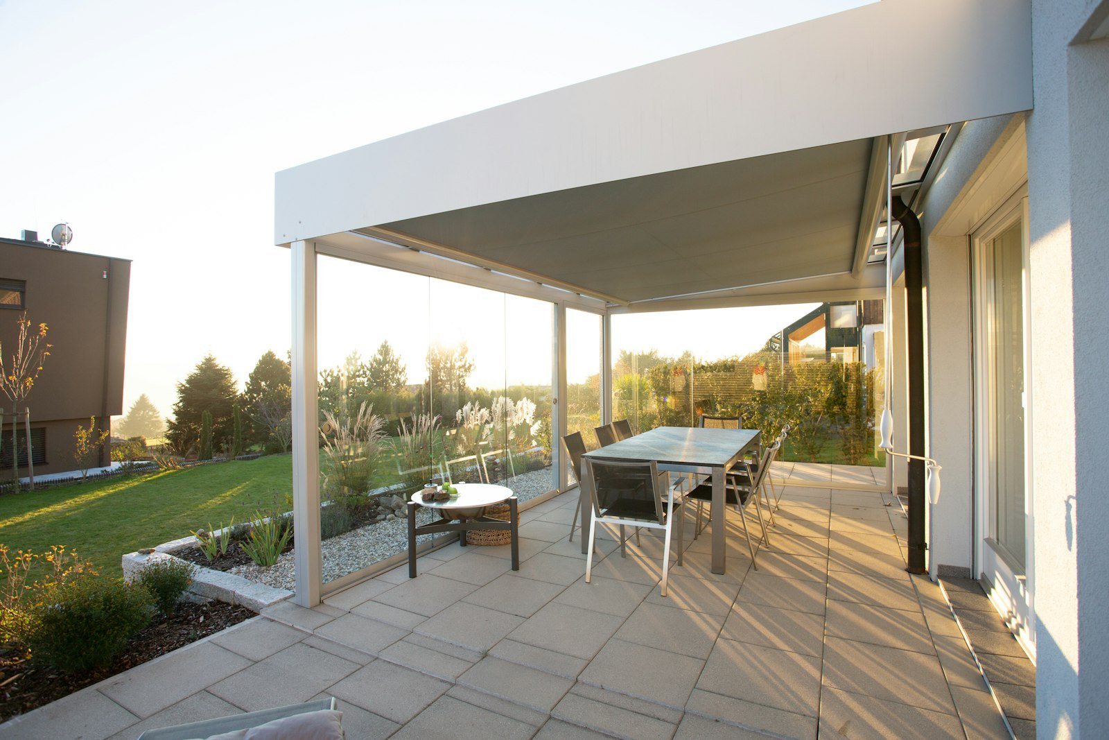 White patio cover attached to the rear of a house